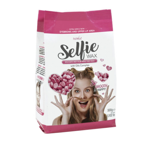 Delikatny wosk niskotemperaturowy do depilacji twarzy z kompleksem olejków w dropsach Italwax Selfie Wax 500 g